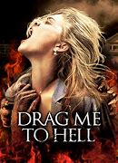 Cover featuring the protagonist of the 2009 movie Drag Me To Hell, she is screaming up towards the top left and hands grab ath her from below
